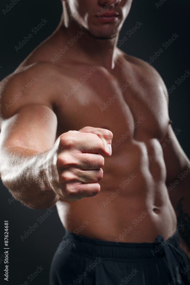 Bodybuilder showing his back and biceps muscles, personal fitnes Bodybuilder showing his back and biceps muscles, personal fitnes