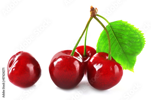 Fresh cherries with leaf isolated on white