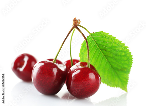 Fresh cherries with leaf isolated on white