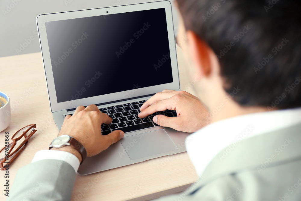 Man working with laptop in office Man working with laptop in office