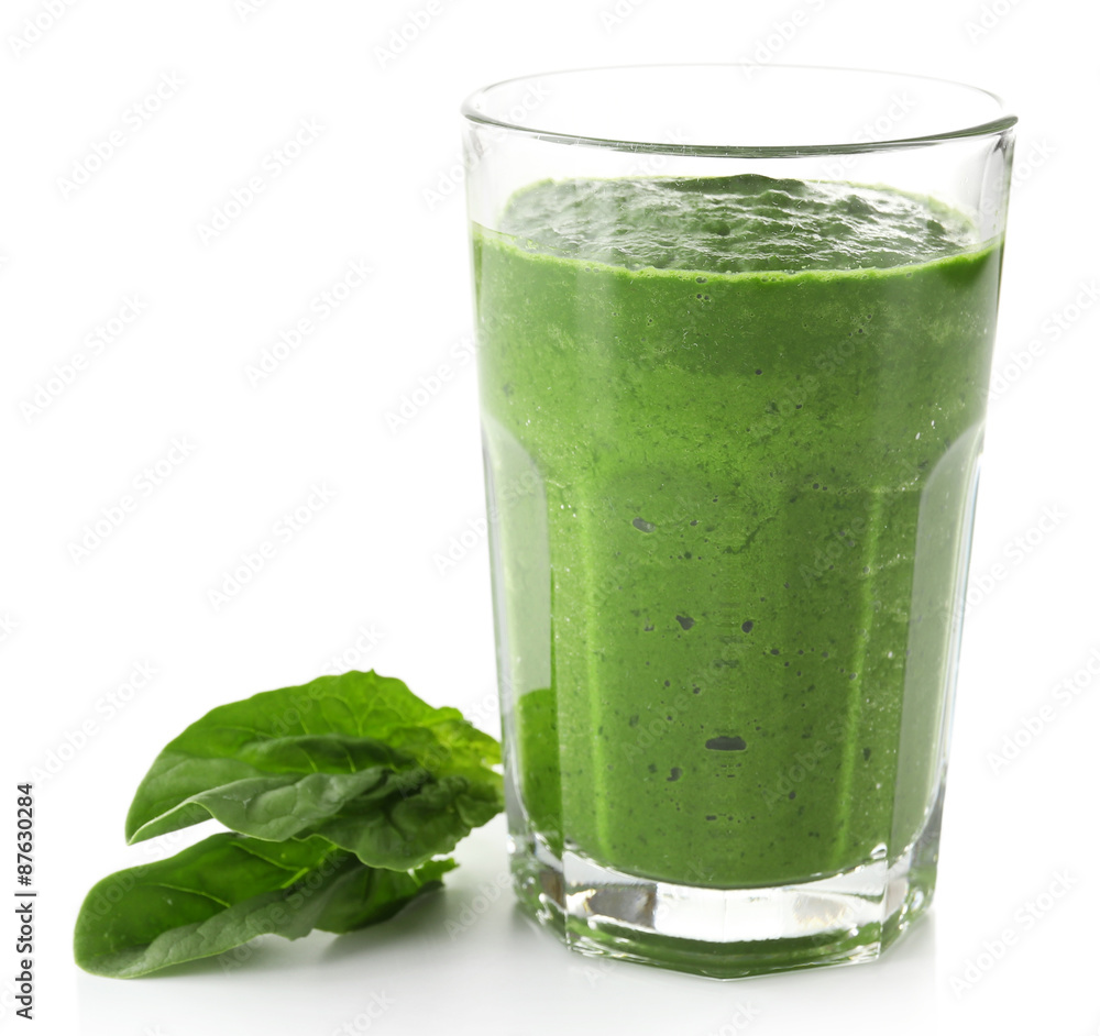 Glass of green vegetable juice with basil isolated on white Glass of green vegetable juice with basil isolated on white