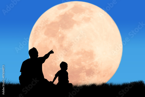 silhouette father hand point his son looking forward at the full