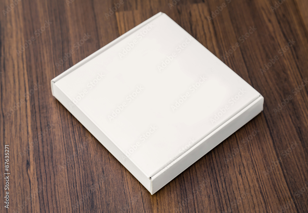 Blank white box mock up on wood background Blank white box mock up on wood background