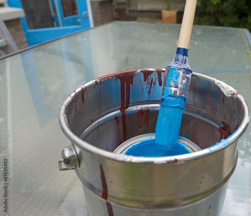 Paint and paint brush ready for painting Paint and paint brush ready for painting