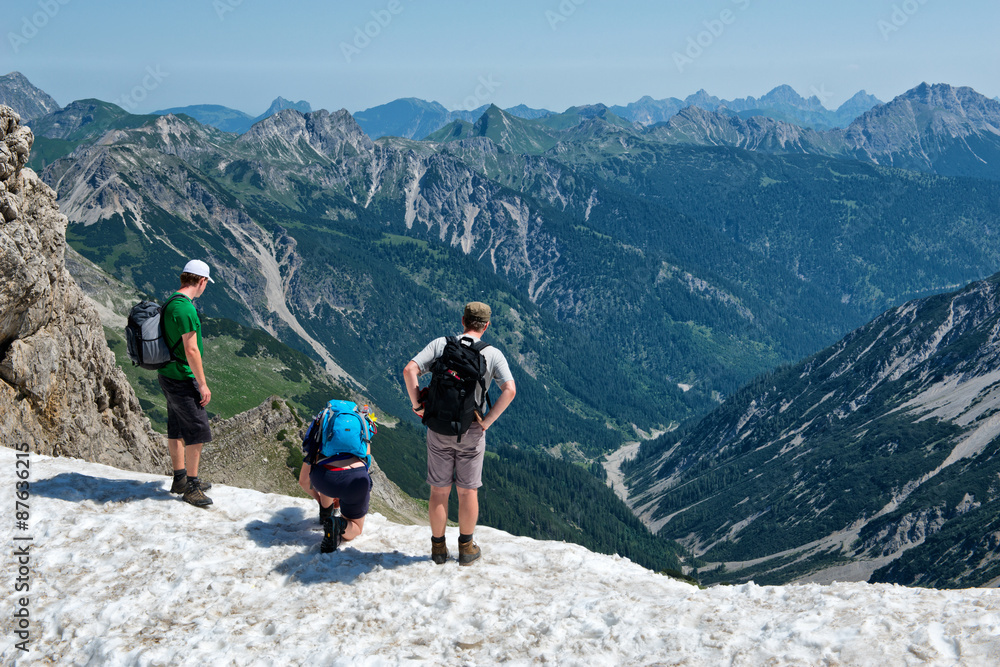 Three climbers on top of Kalter Winkel, Alps