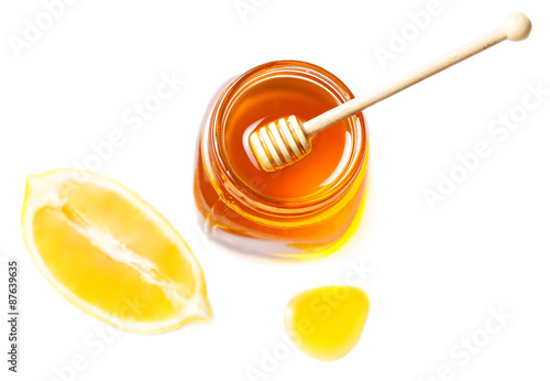 Honey and lemon isolated on a white background. Sweet Honey drip