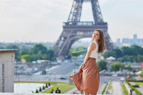 Beautiful young Parisian woman near the Eiffel tower © Ekaterina Pokrovsky