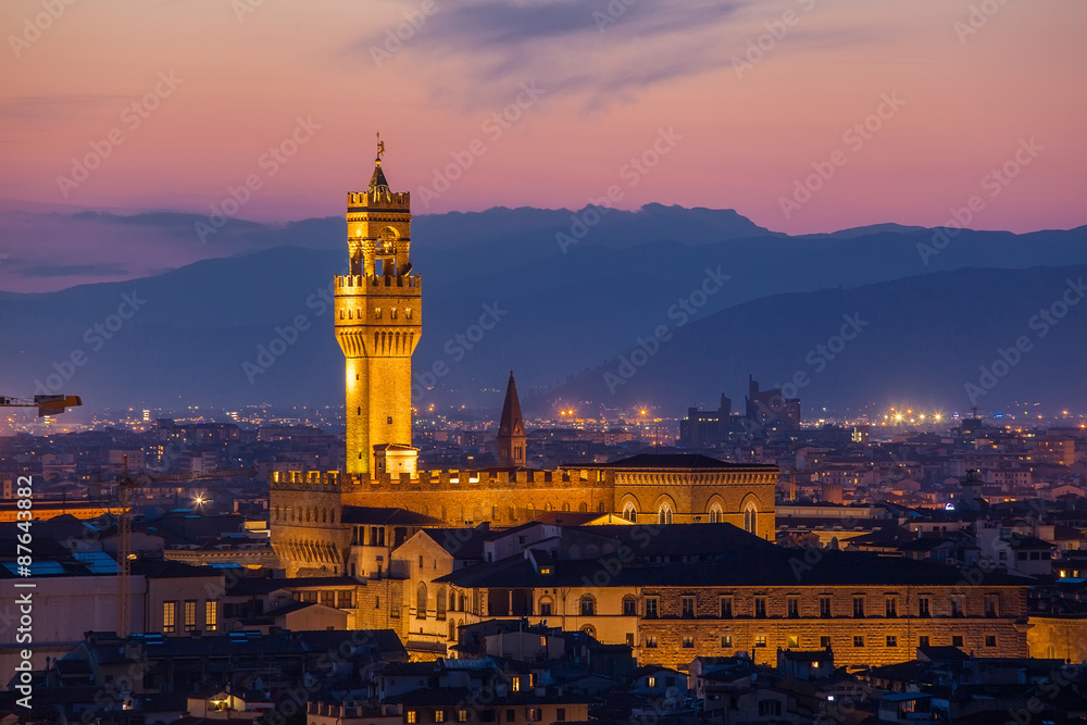 Beautiful view of Palazzo Vecchio in evening illumination and the river Arno, Florence, Italy