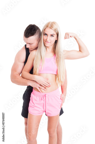 Sexy couple of personal trainers for fitness or aerobic