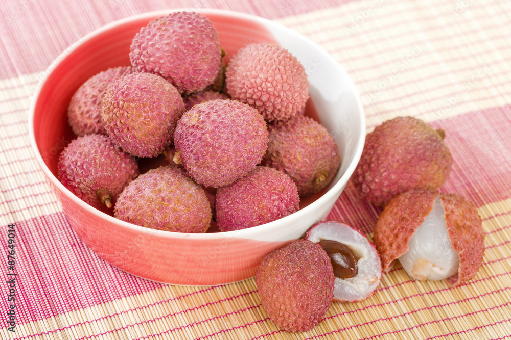 Lychees - Fresh lychees in a pink bowl.
Lychees - Fresh lychees in a pink bowl.