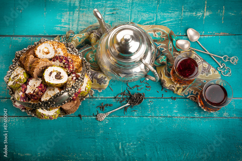 Tea and turkish delight on wooden background