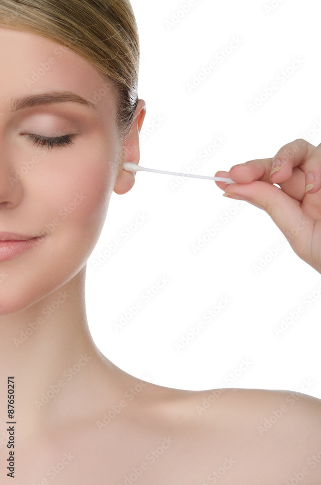 woman is cleaning ear with cotton swab woman is cleaning ear with cotton swab