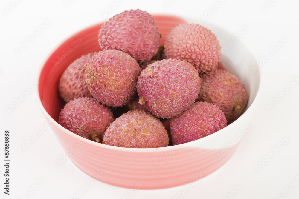 Lychees - Fresh lychees in a pink bowl.
Lychees - Fresh lychees in a pink bowl.