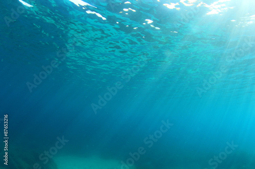 Underwater blue background in ocean with sunlight © Richard Carey