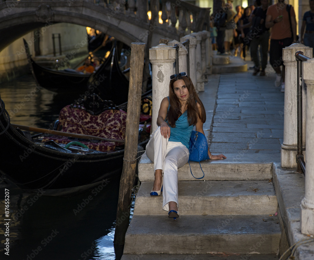 Girl walking in Venice in evening
