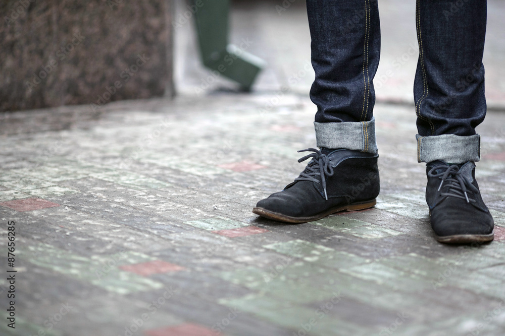Confident man posing in selvedge jeans Confident man posing in selvedge jeans