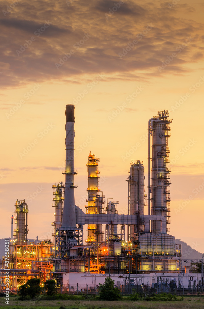 Big Industrial oil tanks in a refinery with treatment pond at industrial plants