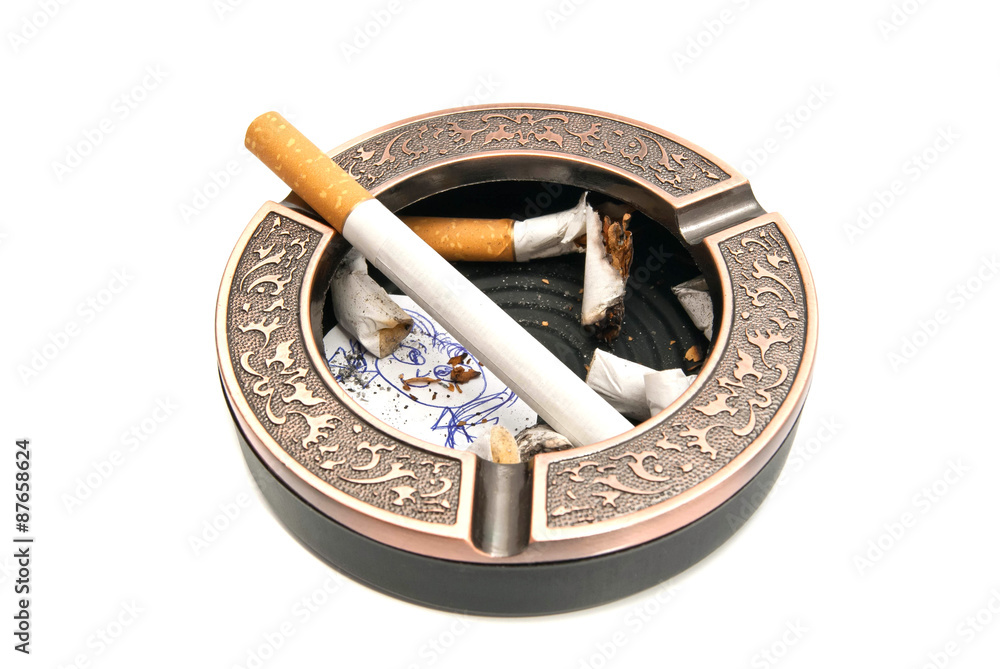 Fototapeta premium ashtray with cigarette butts and portrait of child