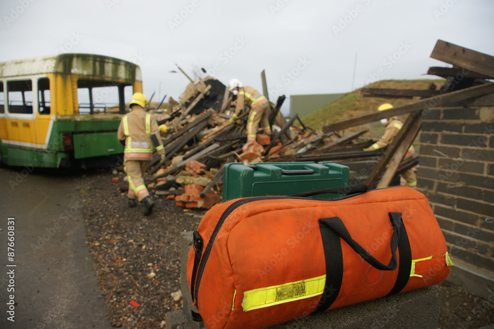 Fototapeta premium fire-fighters at building collapse disastor