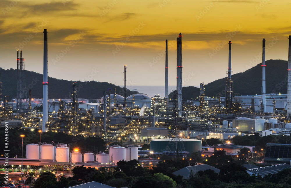 Big Industrial oil tanks in a refinery with treatment pond at industrial plants