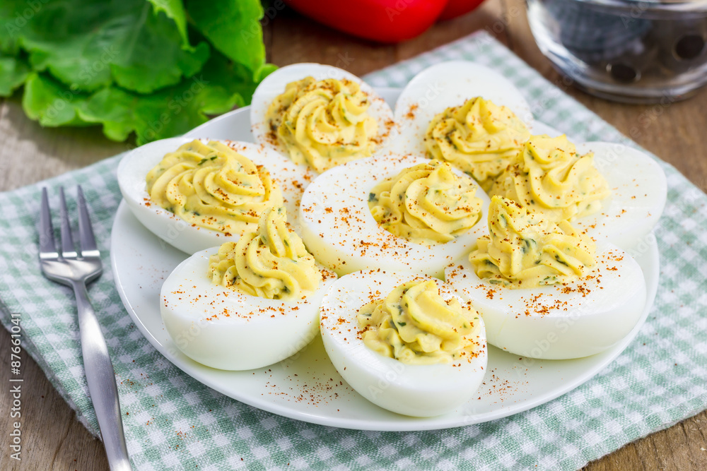 Spicy deviled eggs sprinkled with paprika Spicy deviled eggs sprinkled with paprika