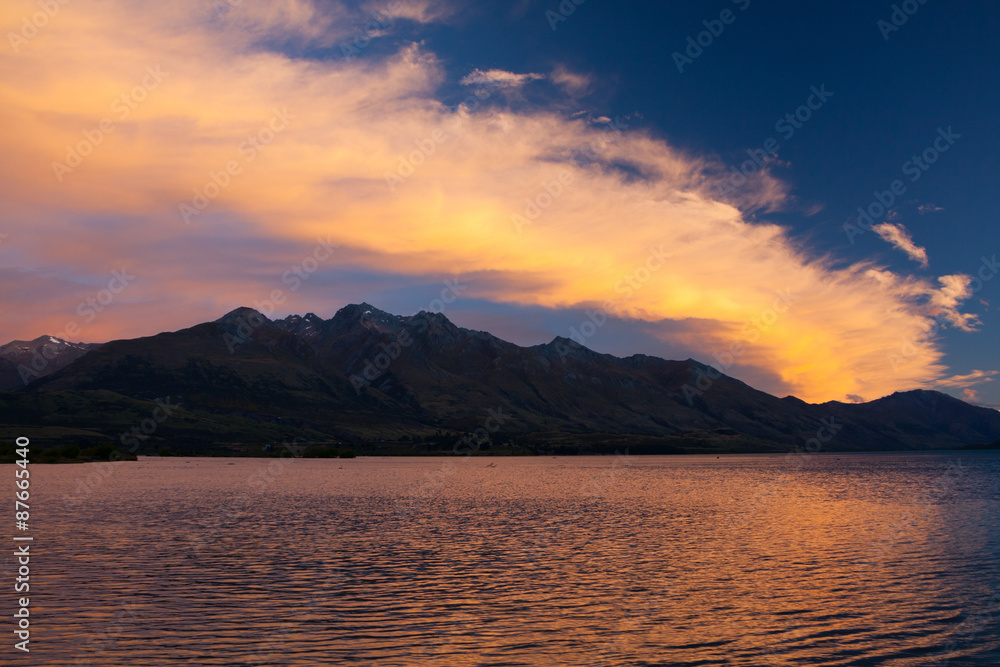 Mountain Lake, Twilight, Dramatic Orange Clouds - New Zealand, Otago, Lake Wakatipu Mountain Lake, Twilight, Dramatic Orange Clouds - New Zealand, Otago, Lake Wakatipu