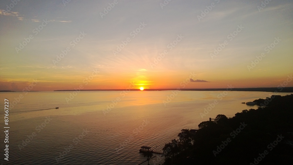 Obraz premium sunset behind the amazon river, manaus, brazil