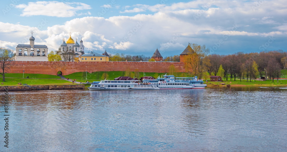 Obraz premium View of the embankment of the River Volkhov and the Kremlin with a bell tower in Veliky Novgorod