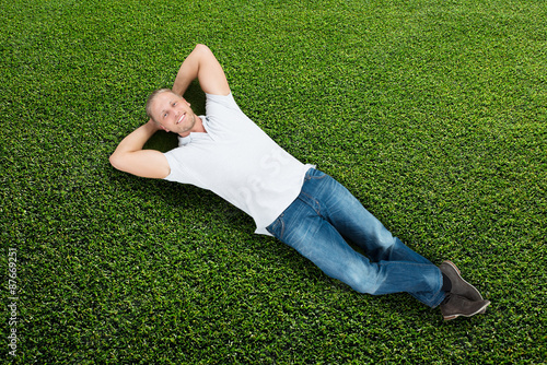 Man Lying On Grass