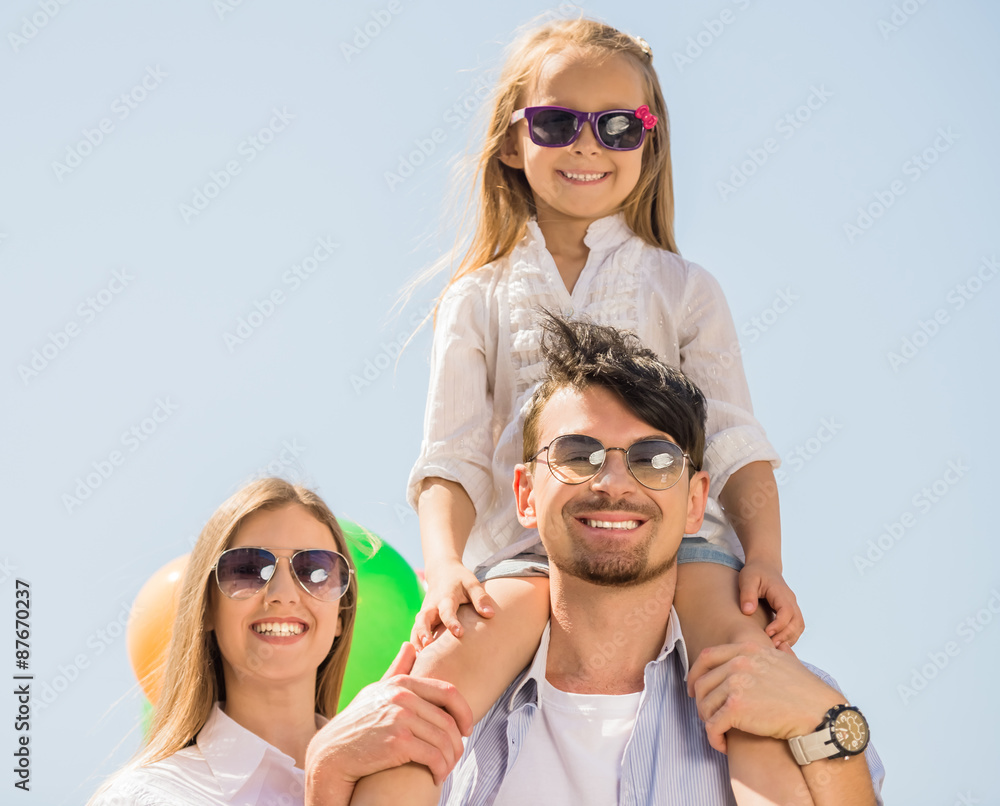 Family with balloons outdoors Family with balloons outdoors
