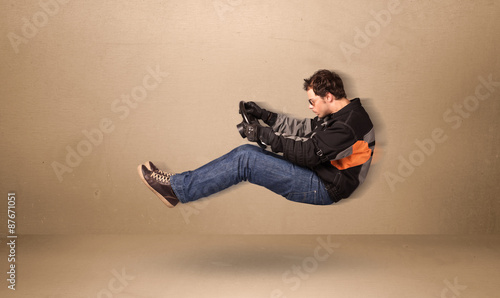 Happy funny man driving a flying car concept