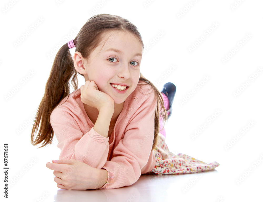 Little long-haired girl lying on the floor Little long-haired girl lying on the floor