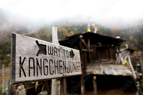 A sign showing the trekking route to Kangchenjunga Base Camps in Nepal, Himalayas.
Kangchenjunga is a third highest mountain in the world.  photo
