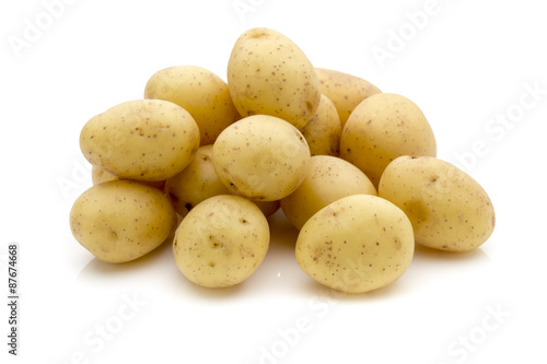 Potatoes on the white background.  New harvest.