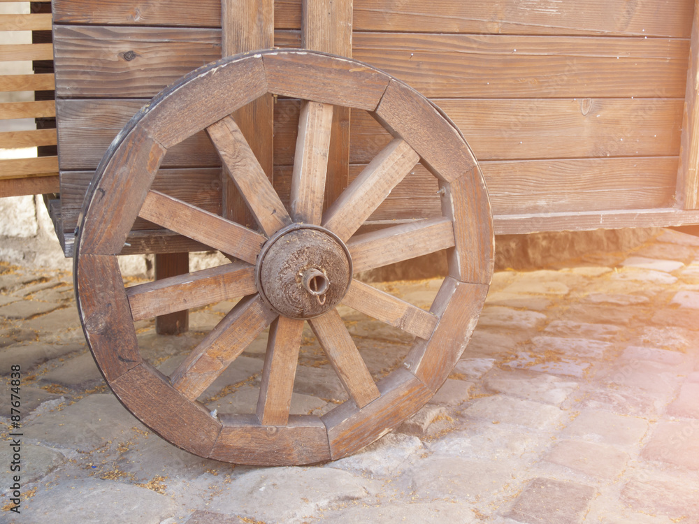 Wooden wheels on the cart.