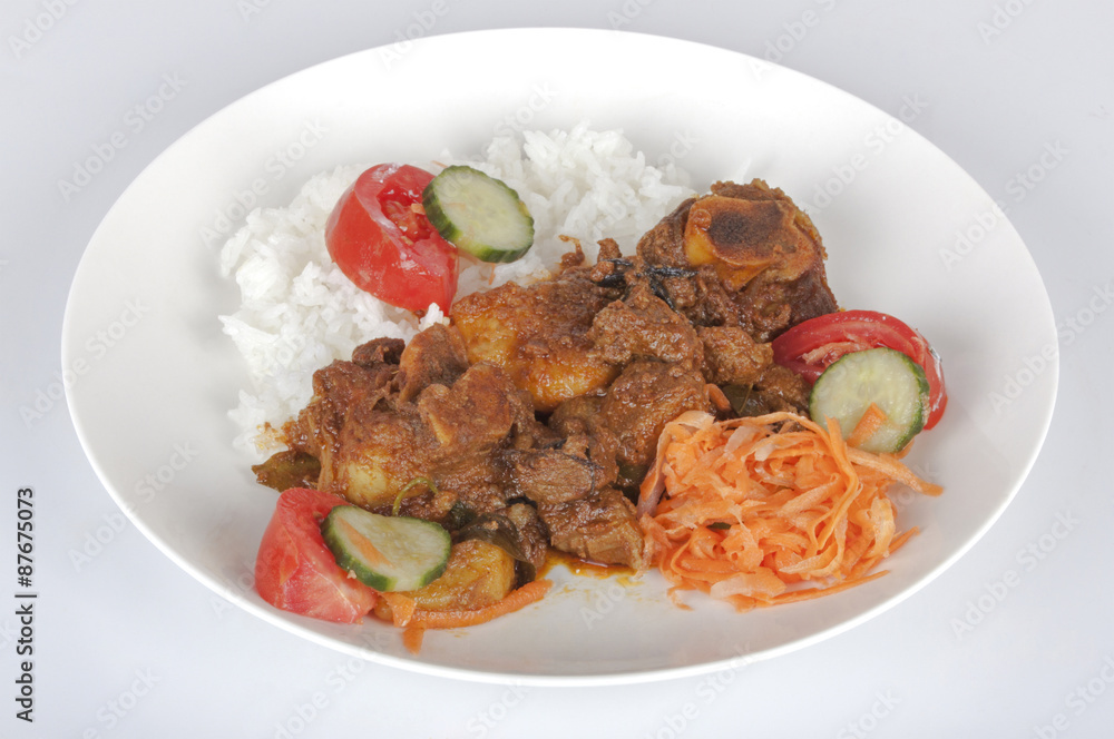Traditional Indian Mutton Curry with Rice and Salads Traditional Indian Mutton Curry with Rice and Salads