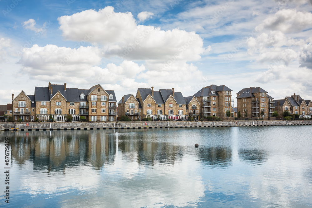 Obraz premium Terrrace house by a marine dock.