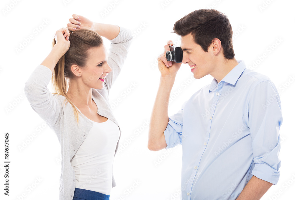 Man taking photo of his girlfriend Man taking photo of his girlfriend