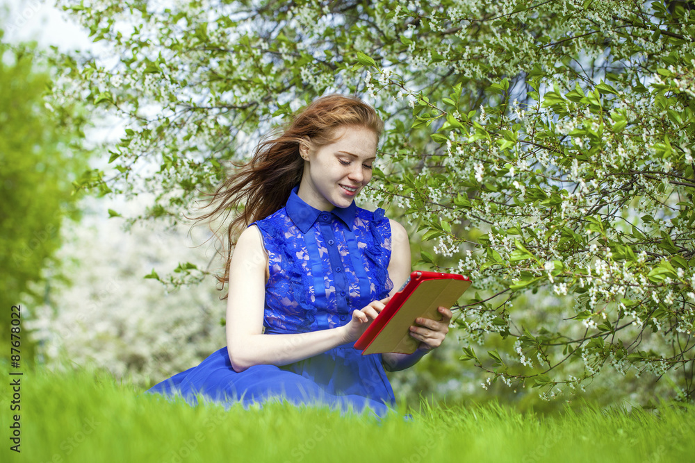Beautiful young girl reading notebook Beautiful young girl reading notebook