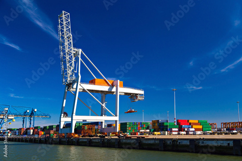 Large container crane in Port of Rotterdam waiting to unload the vessel