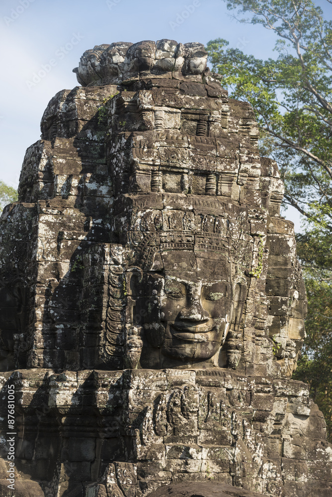 Ancient stone faces of king Jayavarman VII at The Bayon temple,