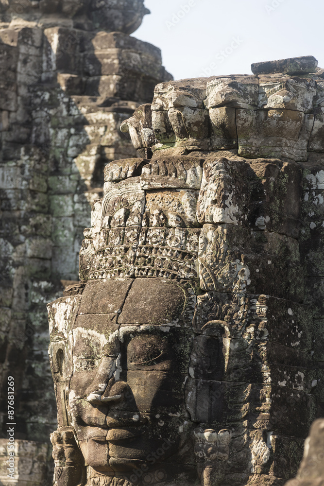 Ancient stone faces of king Jayavarman VII at The Bayon temple,