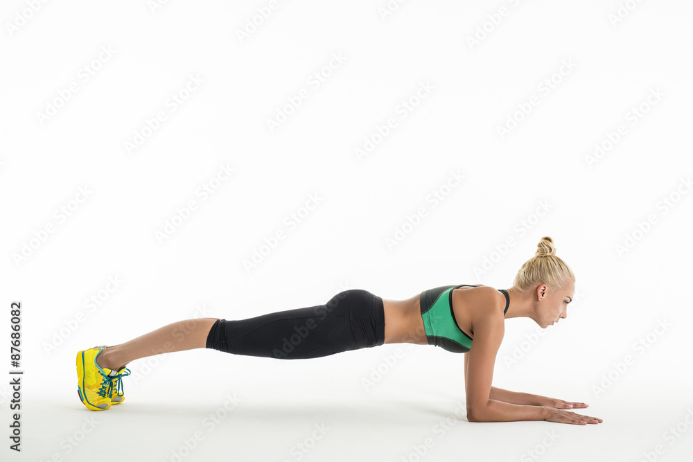 Rhythmic gymnast doing exercise in studio. Rhythmic gymnast doing exercise in studio.