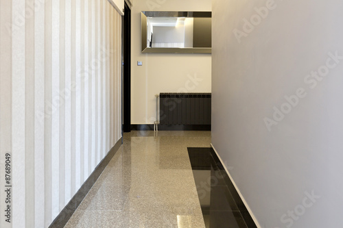 Shiny marble floor in hotel corridor