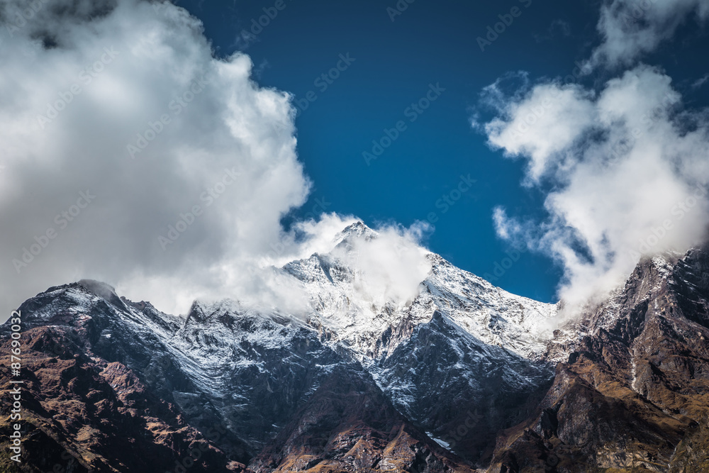 Snowy mountain peak and clouds, Himalaya, Nepal