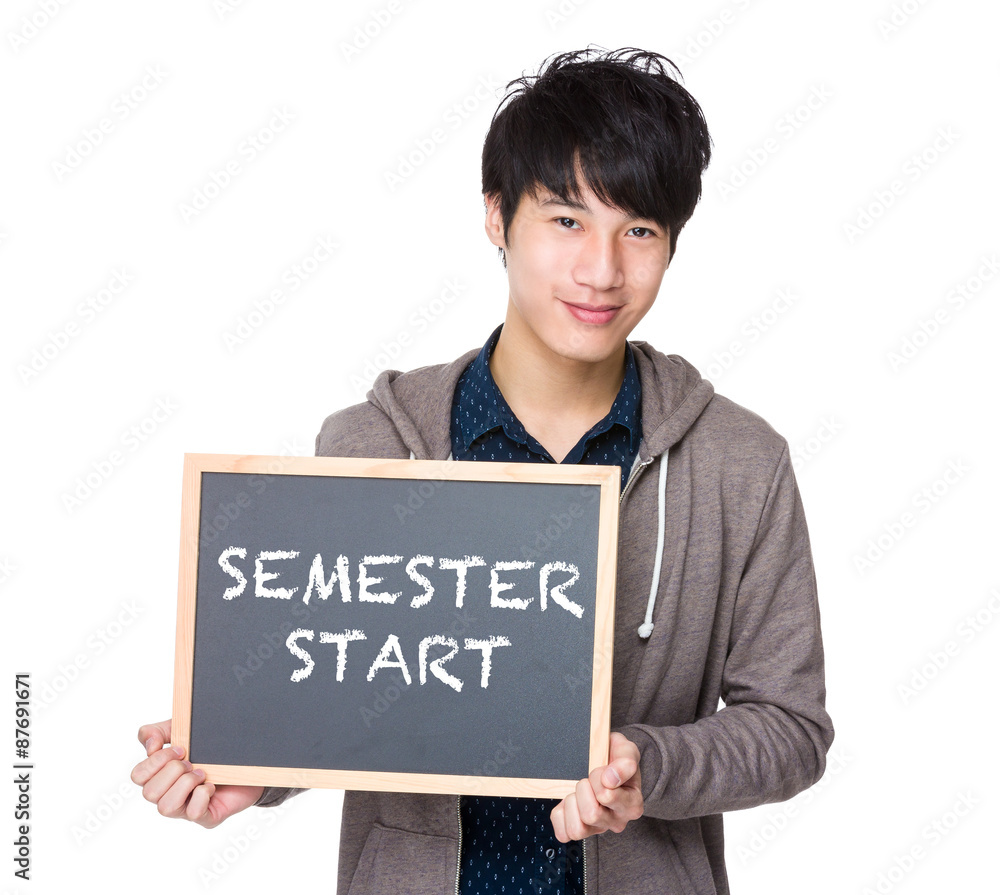 Asian young student with blackboard showing phrases of semester Asian young student with blackboard showing phrases of semester
