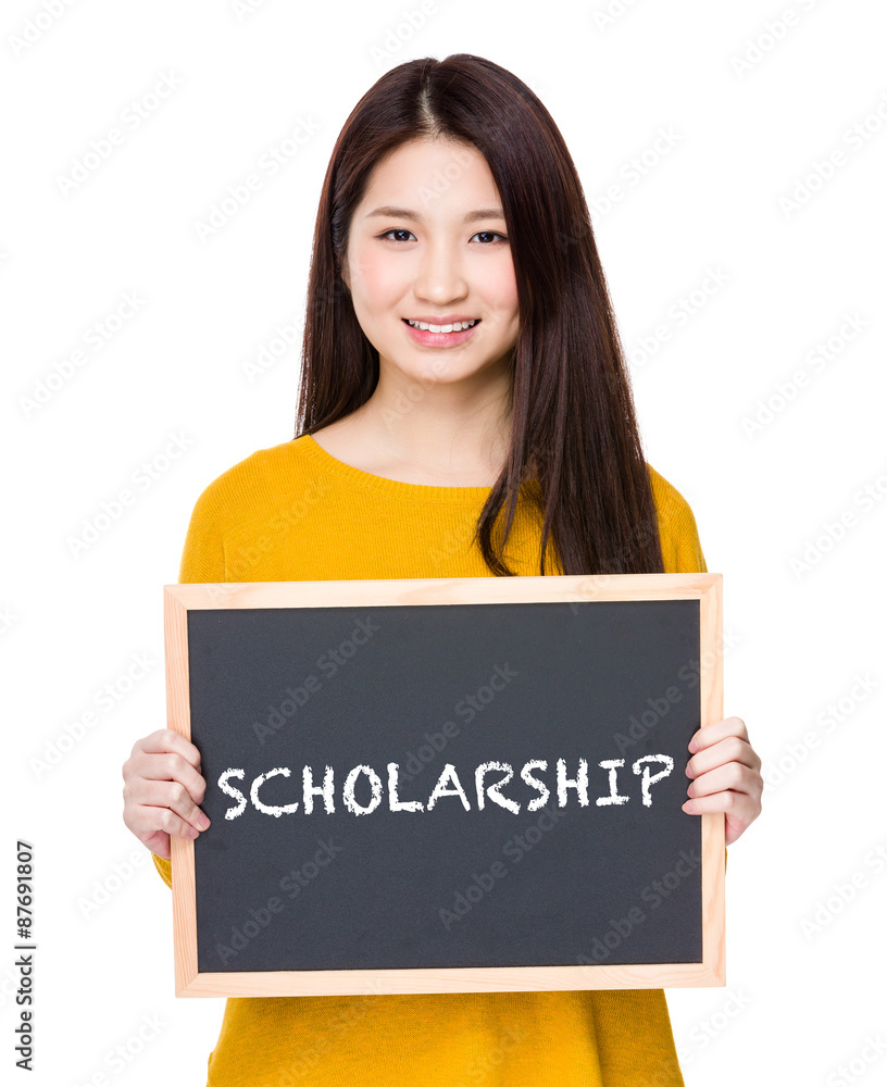 Woman hold blackboard showing a word scholarship Woman hold blackboard showing a word scholarship