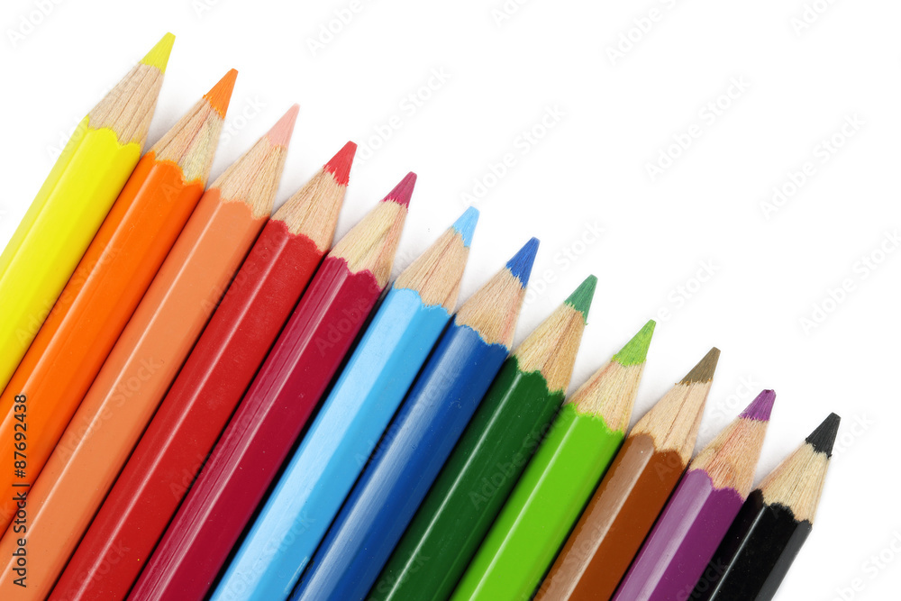 close up of colored pencils isolated on white background close up of colored pencils isolated on white background