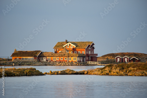 Red cottages in Norway at sunset #87692639