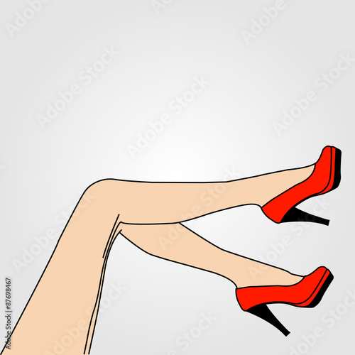 Legs of a woman wearing red stilettos 